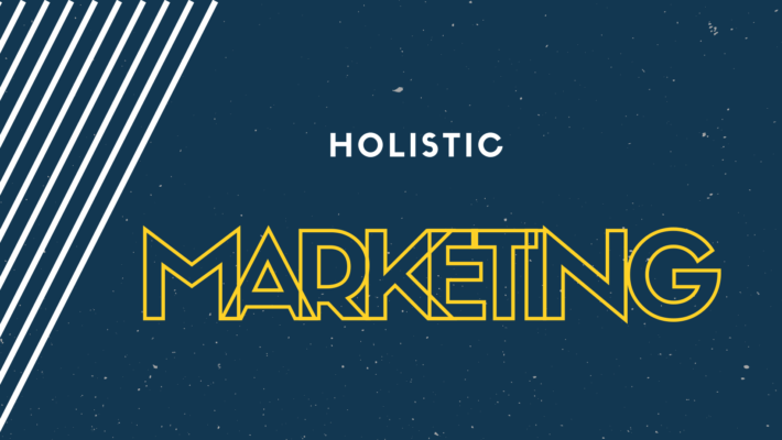 Blue image with white and yellow text saying Holistic Marketing for an article about holistic marketing.