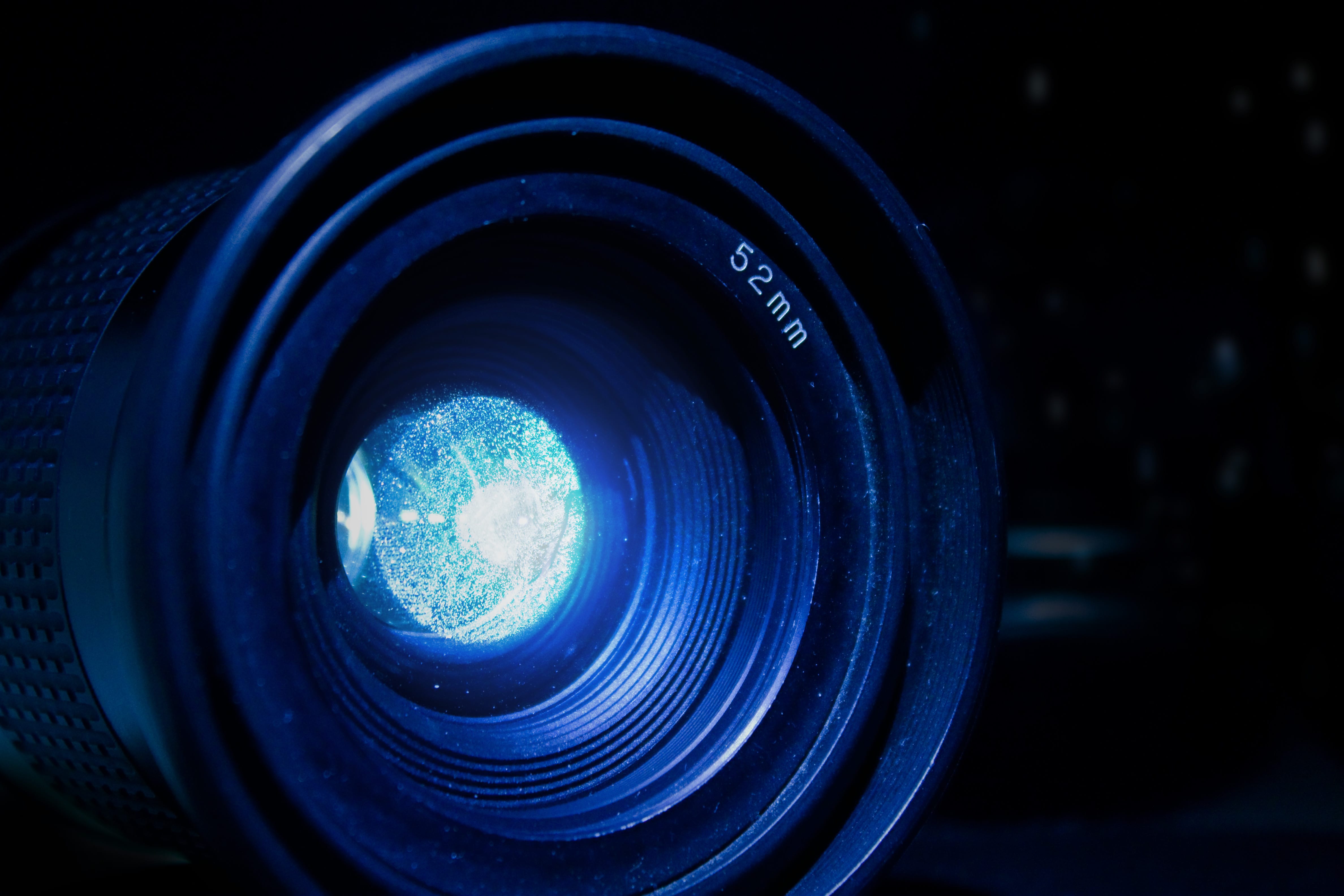 Image of a camera lens for an article about how you can build confidence on camera to help boost your marketing plans.