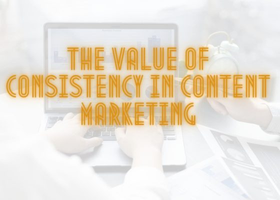 Graphic with a computer desk background and text overlay saying The Value of Consistency in Content Marketing.