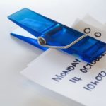 Image of a paperclip holding a to-do list for an article about how to write SEO content.
