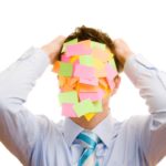 Image of a man with post-it notes on his face for an article about what SEO backlinks are and how to use them to drive traffic to your website.